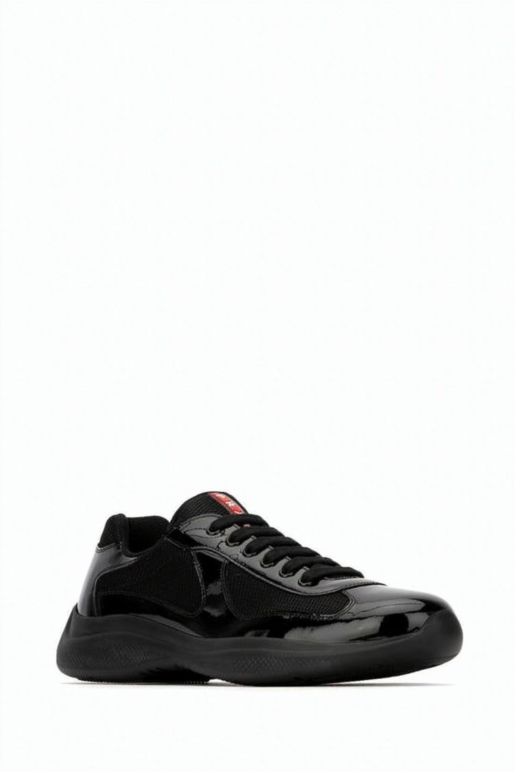 Prada Glossy Black Low-Profile Sneakers With Red Logo Detail