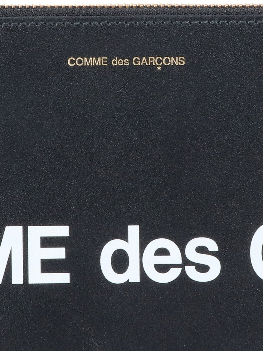 Comme Des Garçons Black Leather Pouch Wallet With Logo Print And Gold Accents