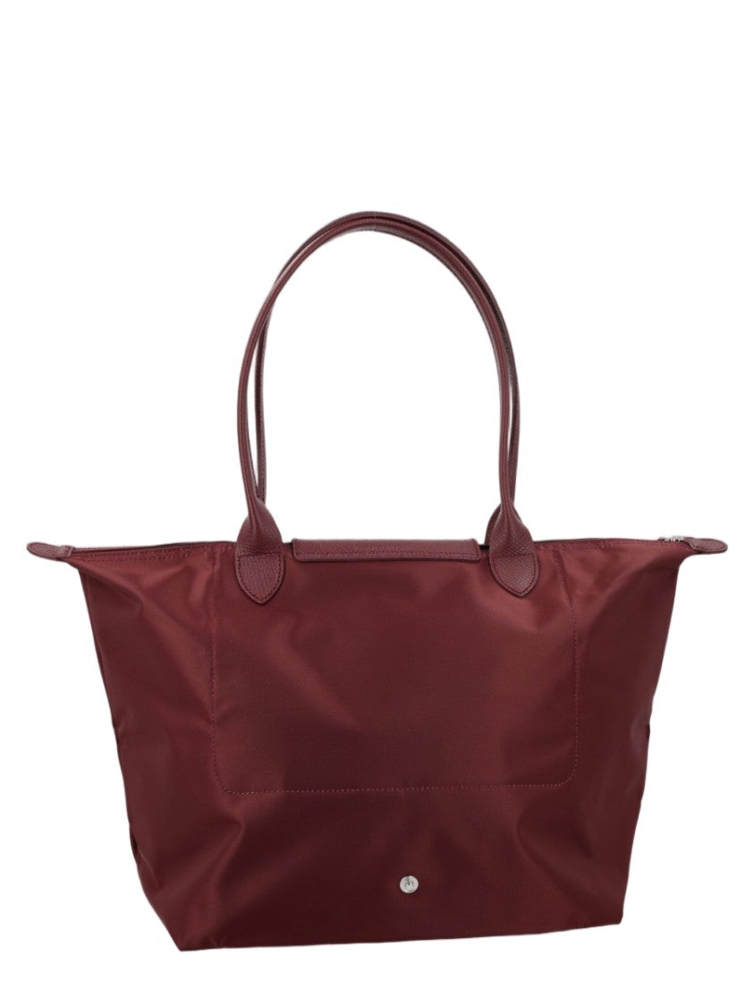 Longchamp Spacious Trapezoidal Tote Bag With Dual Handles And Zippered Closure