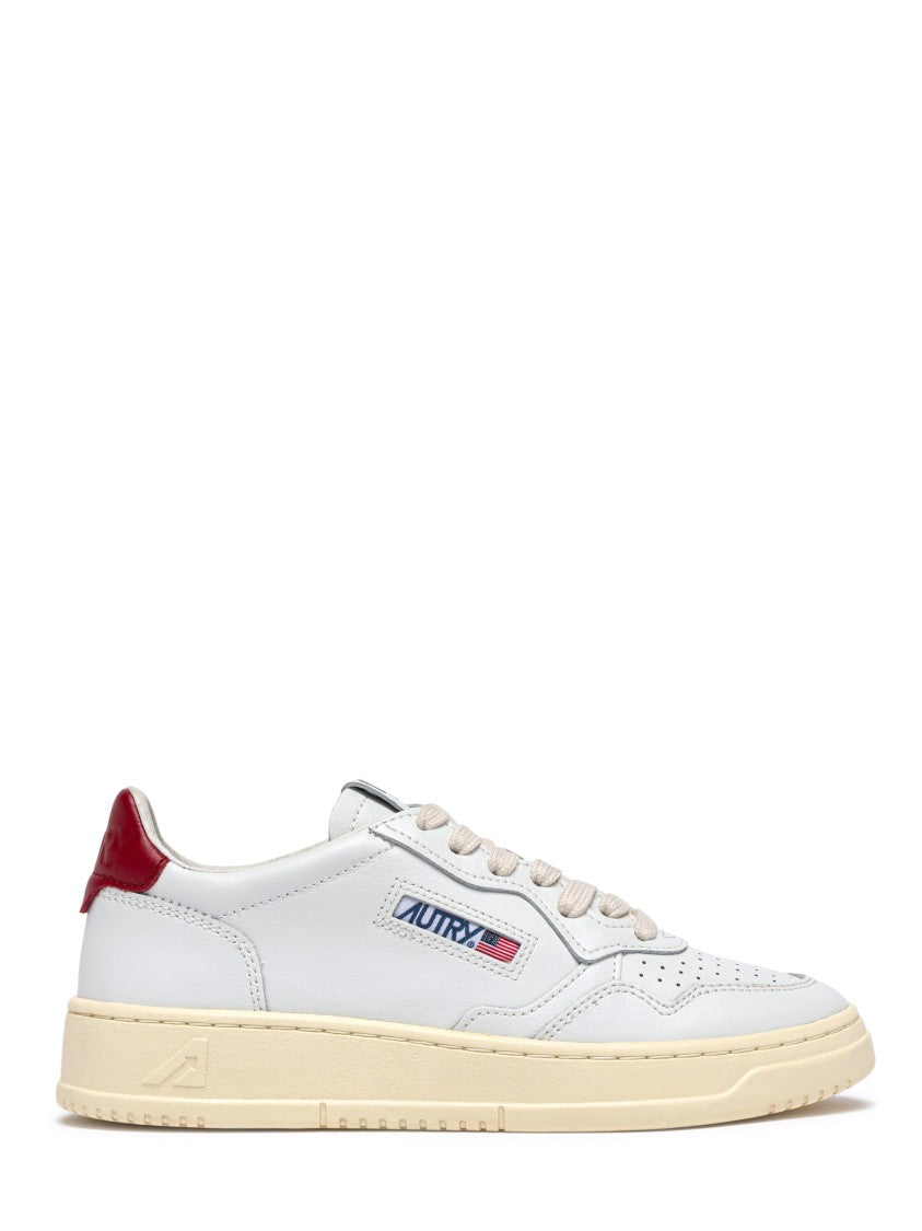 Autry Low-Top Leather Sneakers With Perforated Detailing And Claret Accents