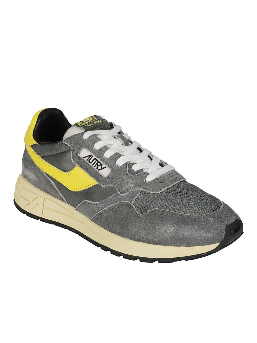 Autry Low-Top Sneakers With Textured Grey Upper And Bold Yellow Accents