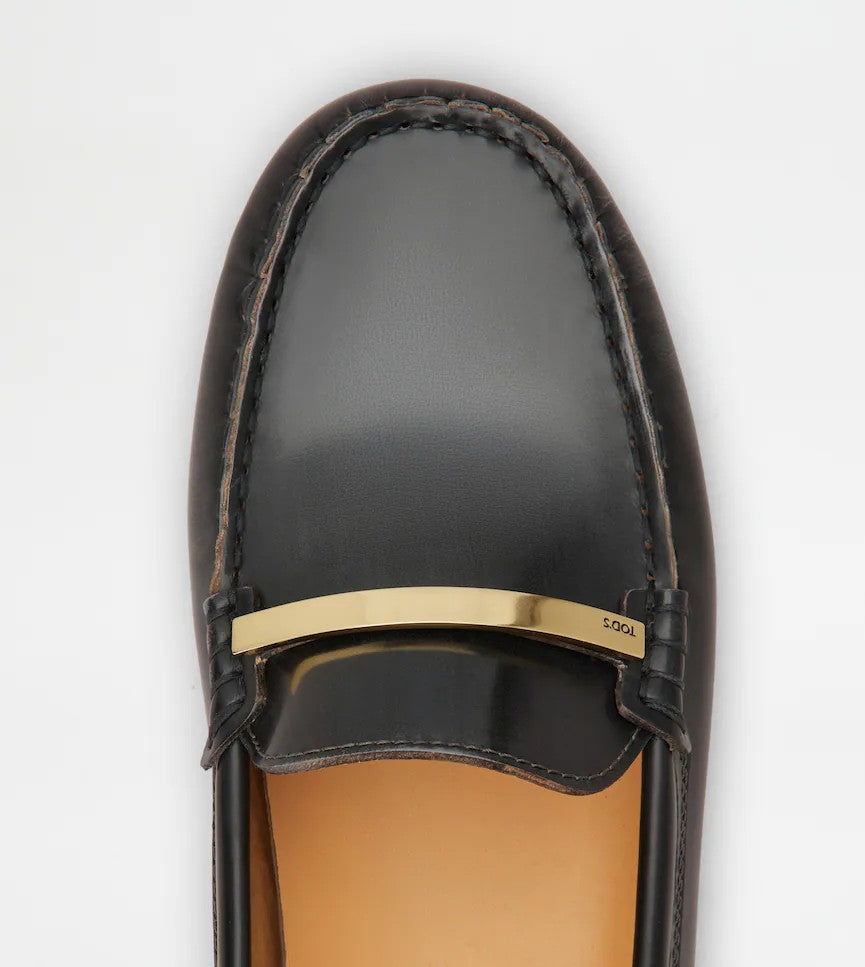Tod's Polished Calfskin Moccasins With Metallic Bar Accent