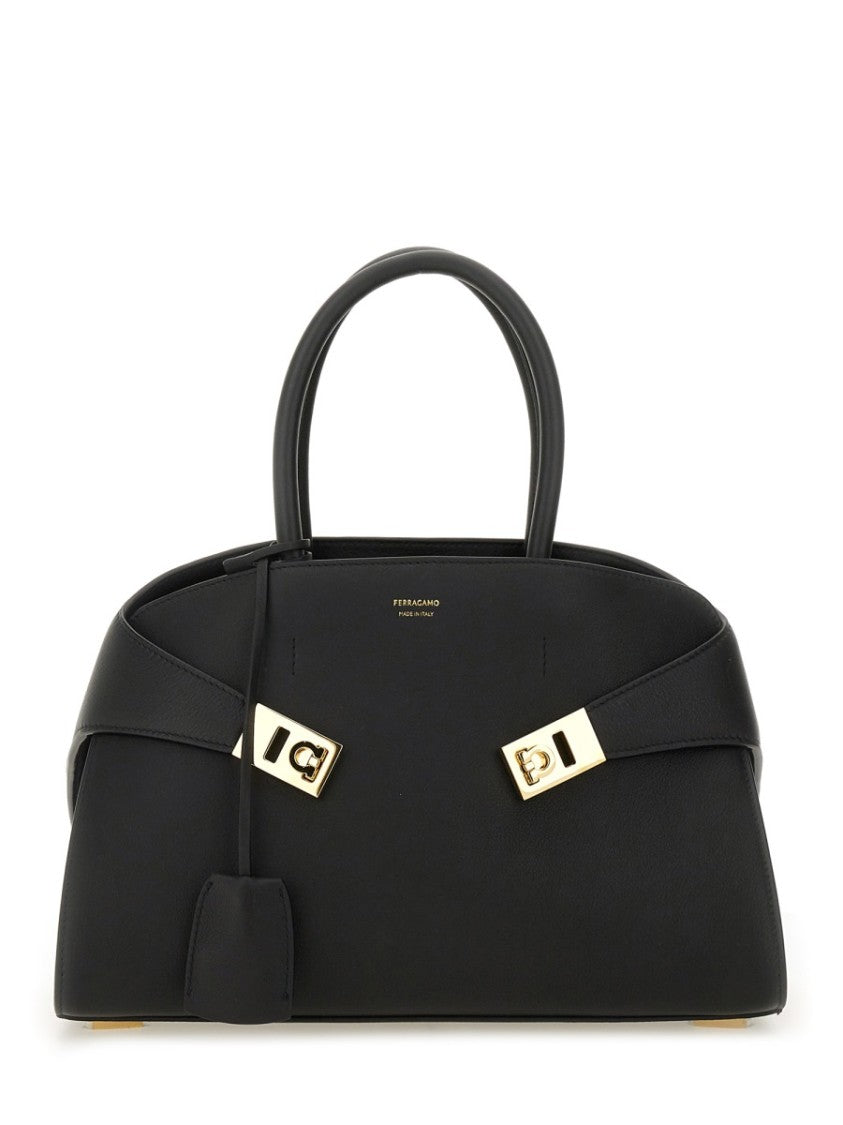 Ferragamo Structured Black Tote Bag With Curved Silhouette And Gold-Tone Accents
