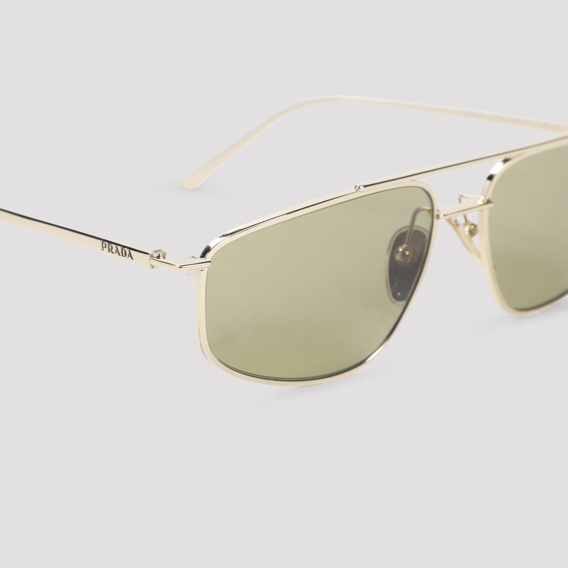 Prada Metallic Frame Sunglasses With Green-Tinted Lenses
