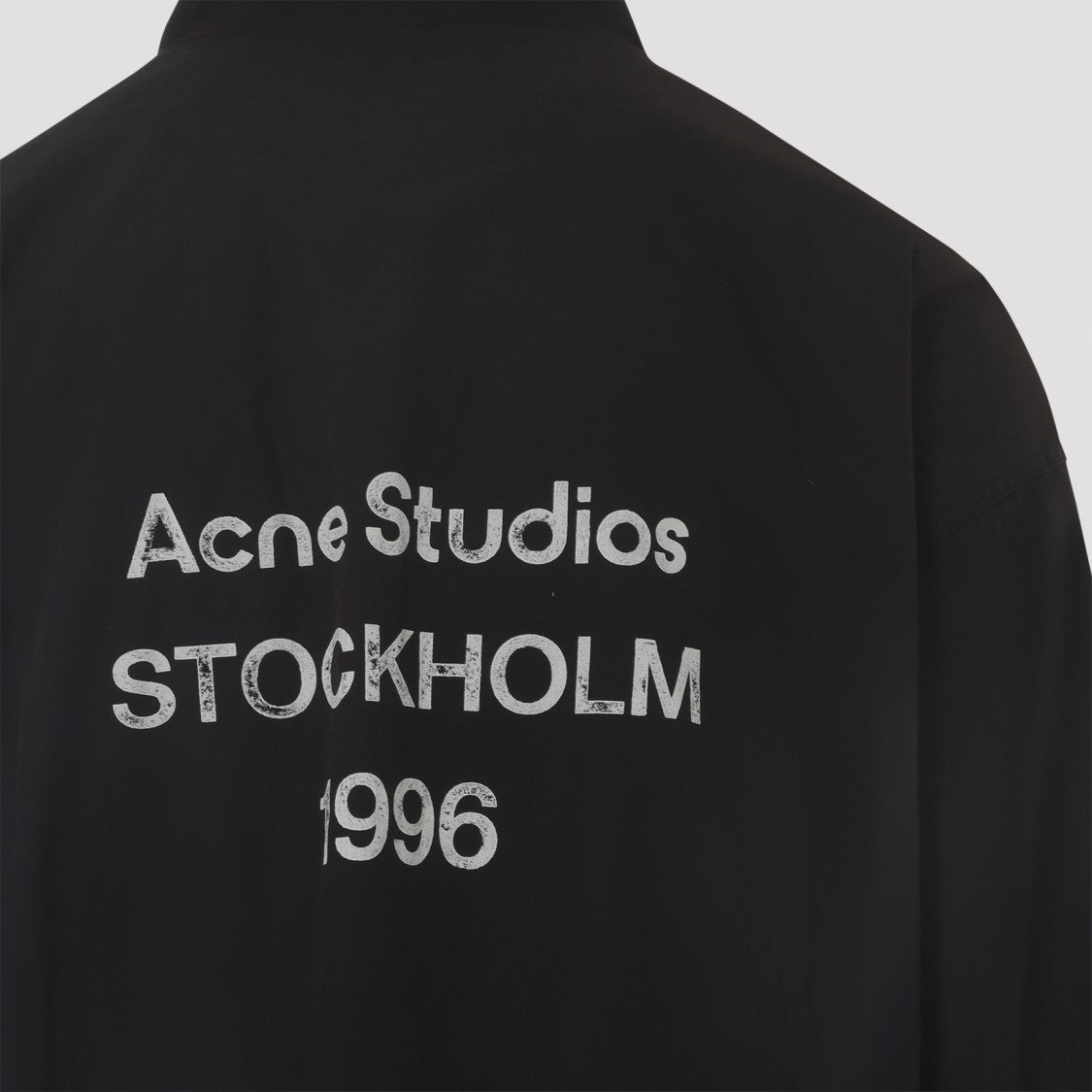 Acne Studios Pure Black Cotton Jacket With Stand-Up Collar And Distressed Text