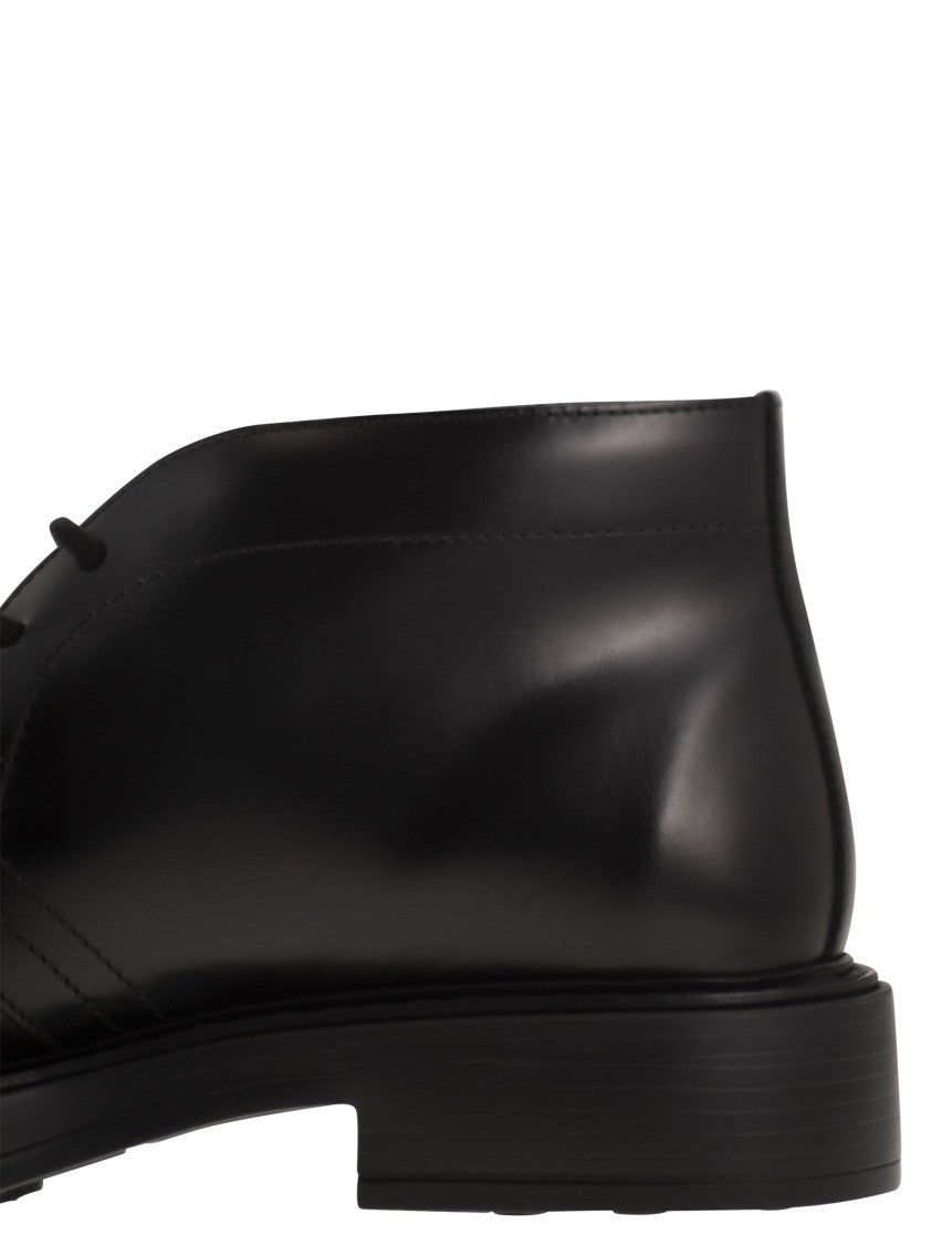 Tod's Calfskin Ankle Boots With Embossed Monogram