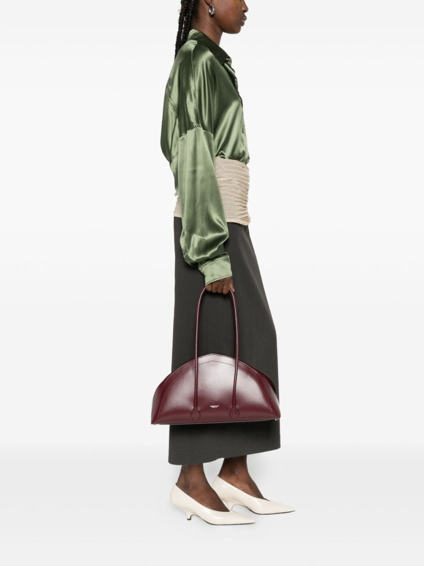 Federico Cina Bordeaux Handbag With Elongated Semi-Circular Silhouette