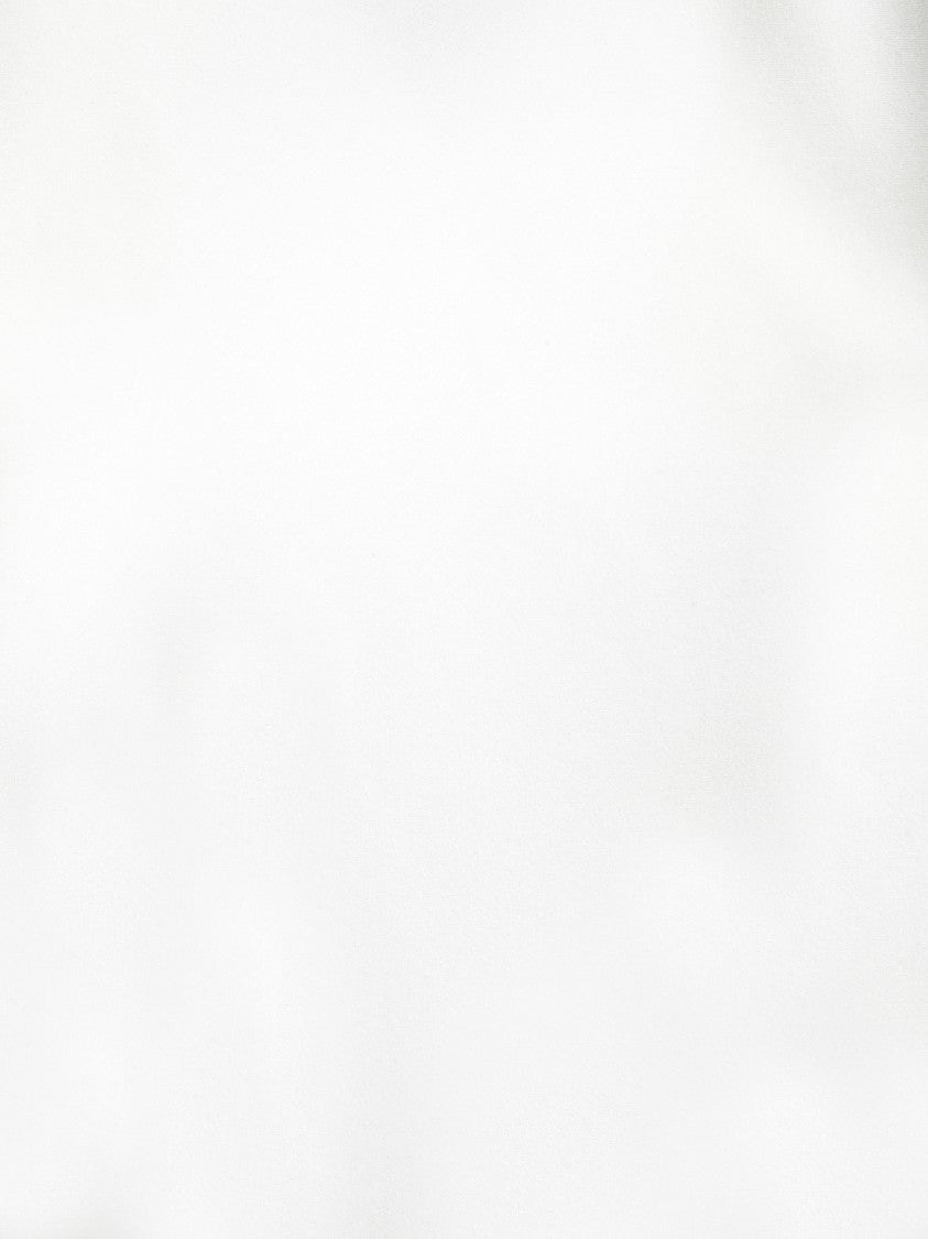 Blanca Vita White Top With Flattering Sleeveless Design