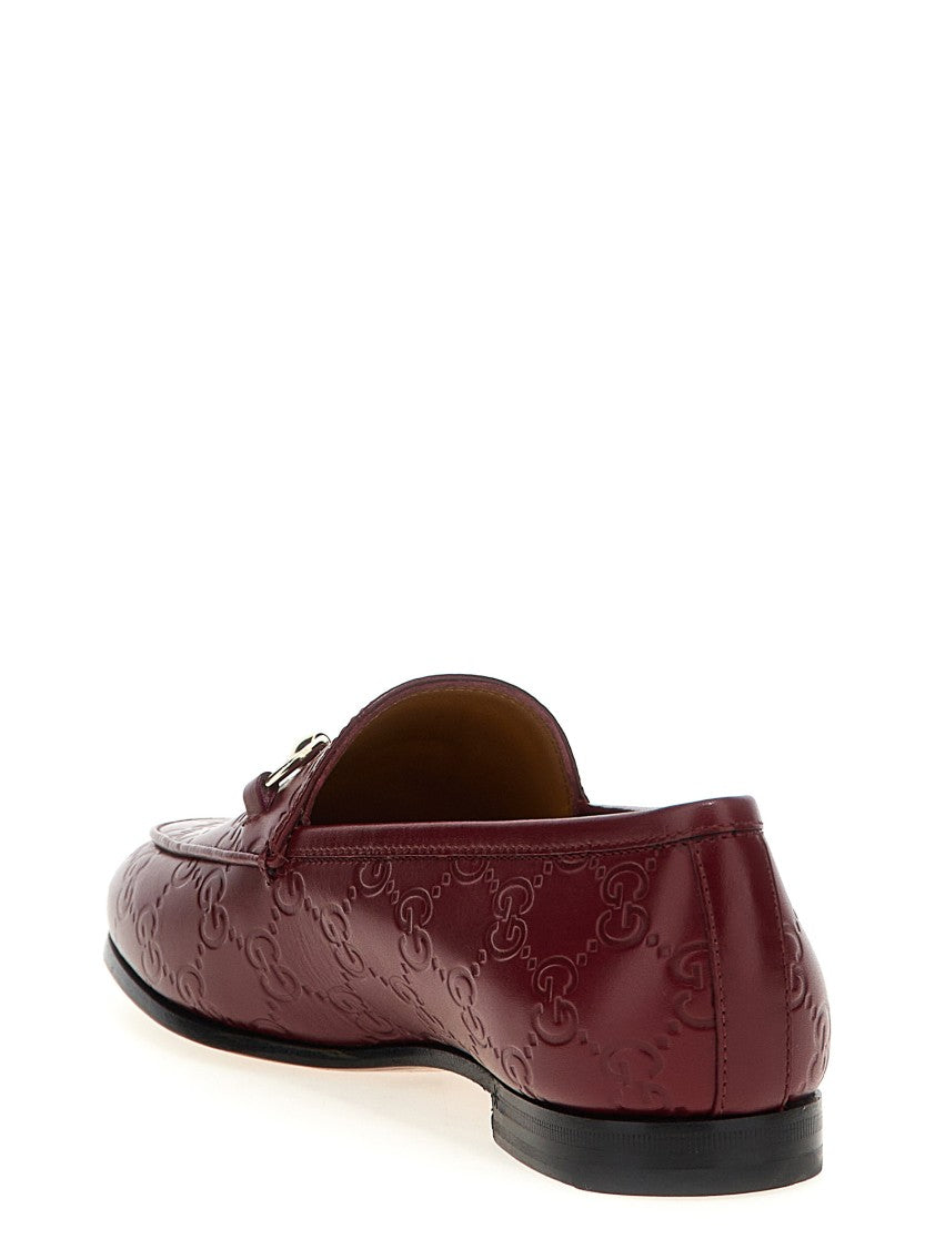 Gucci Gg Leather Jordaan Loafers With Metal Clamp Detail