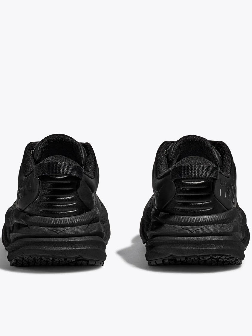 Hoka Black Cushioning Shoes With Wave-Pattern Sole And Comfort Features