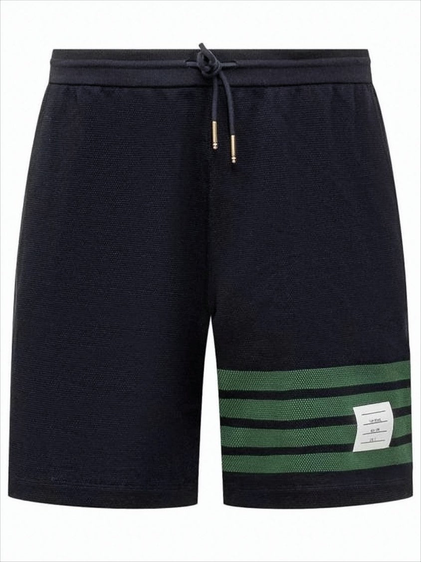 Thom Browne Tailored Black Shorts With Distinctive Green Stripe Detail