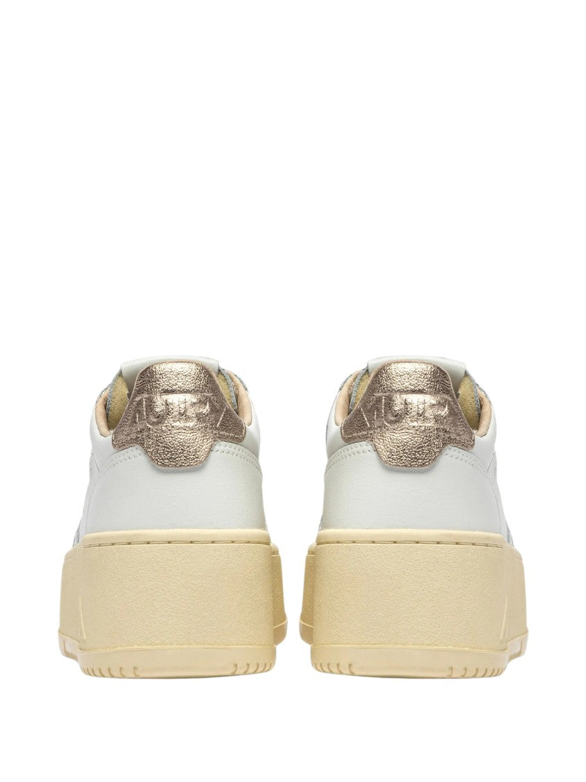 Autry Low-Top Platform Sneakers With Perforated Detailing And Metallic Accents