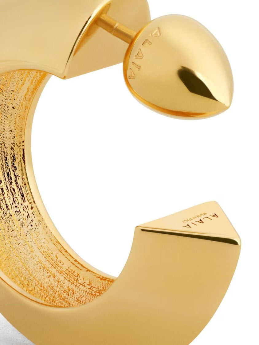 Alaïa Gold Polished Curved Textured Hoop Earrings