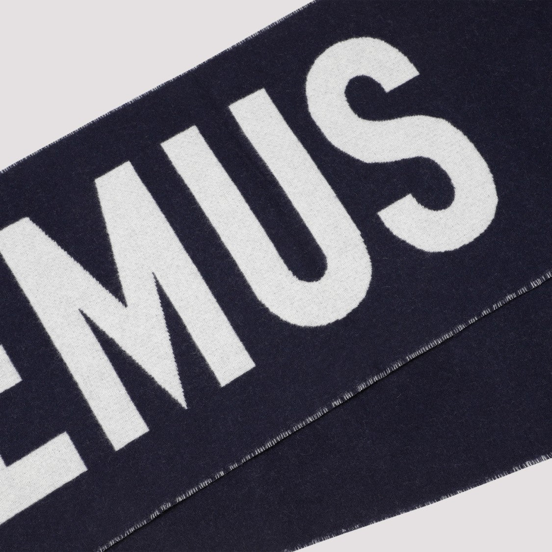 Jacquemus Bold Graphic Wool Scarf With Fringed Edges