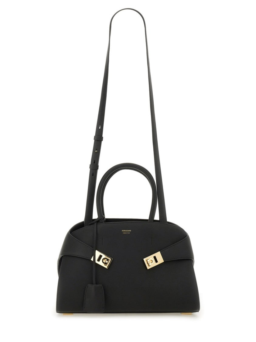 Ferragamo Structured Black Tote Bag With Curved Silhouette And Gold-Tone Accents