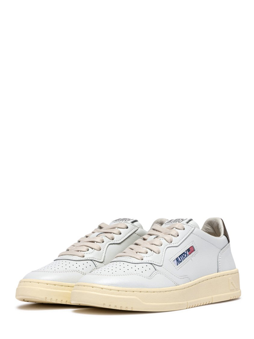 Autry Low-Top Sneakers With Perforated Detailing And Vintage Aesthetic