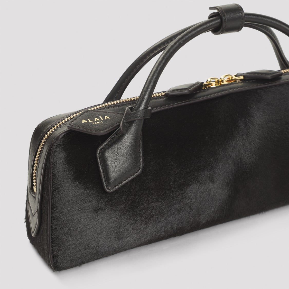 Alaïa Teckel Calf Hair Clutch With Gold-Toned Accents