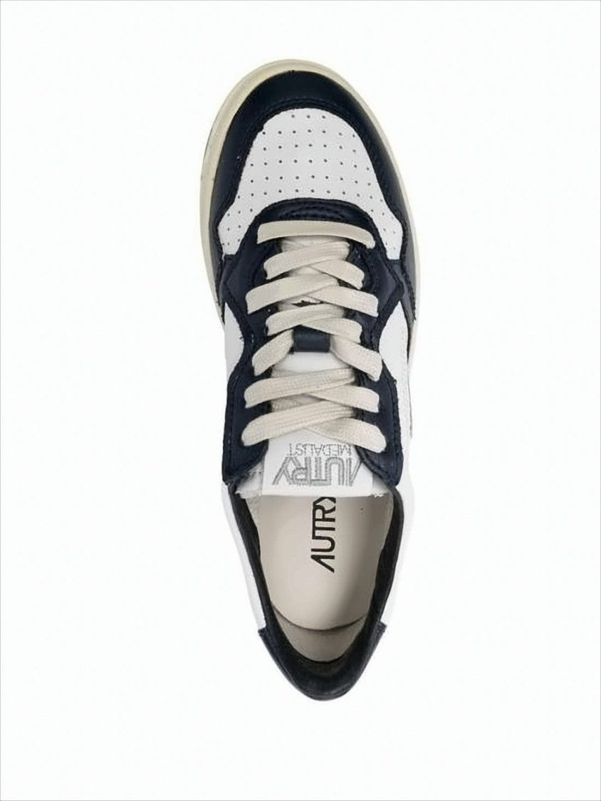 Autry Low-Top Leather Sneakers With Navy Overlays And Perforated Details