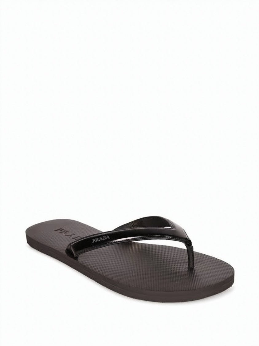 Prada Minimalist Slip-On Sandals With Textured Footbed And Glossy Strap