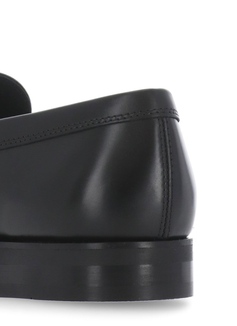 Tod's Black Embossed Monogram Loafers