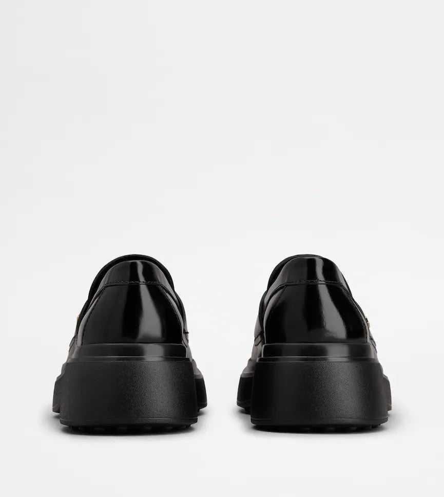 Tod's Timeless Black Calfskin Loafers With Textured Sole