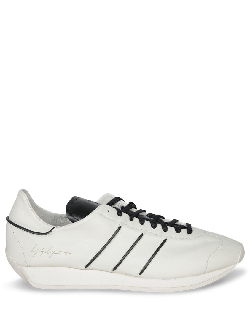 Adidas Minimalist White Sneakers With Signature Detailing