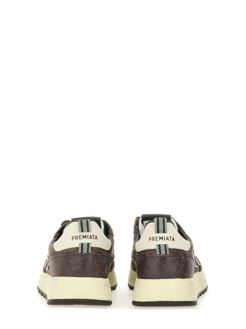 Premiata Layered Brown Sneakers With Textured Accents And Cream Sole