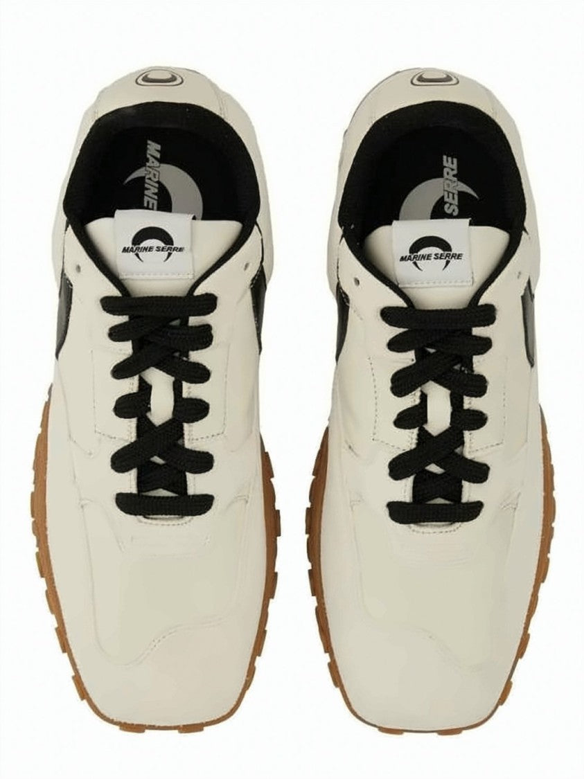 Marine Serre Sleek Off-White Sneakers With Bold Black Accents