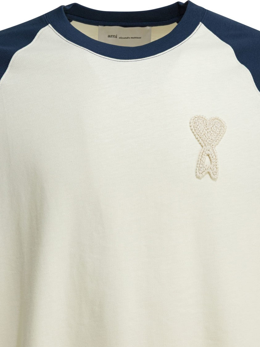Ami Paris Raglan T-Shirt In Cream With Navy Blue Sleeves And Heart Emblem