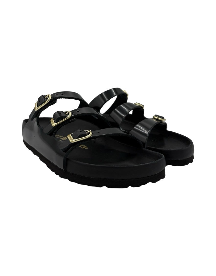 Birkenstock Sleek Black Sandals With Adjustable Straps And Gold Accents