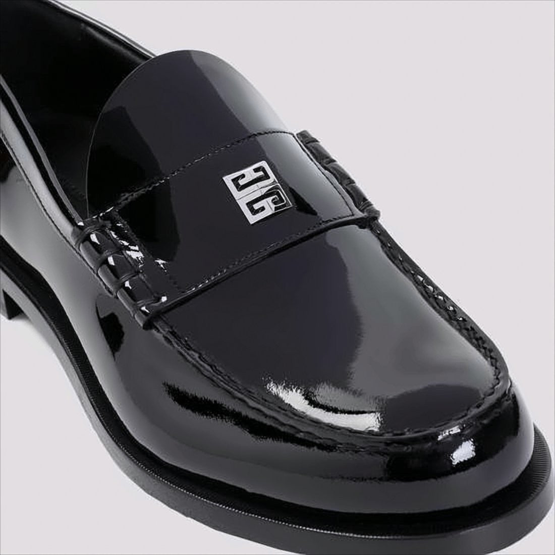 Givenchy Glossy Black Moc Toe Loafers With Metallic Details