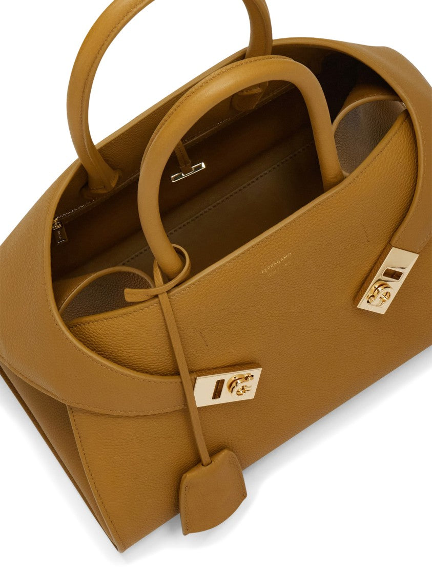 Ferragamo Curved Silhouette Structured Handbag With Gold Accents