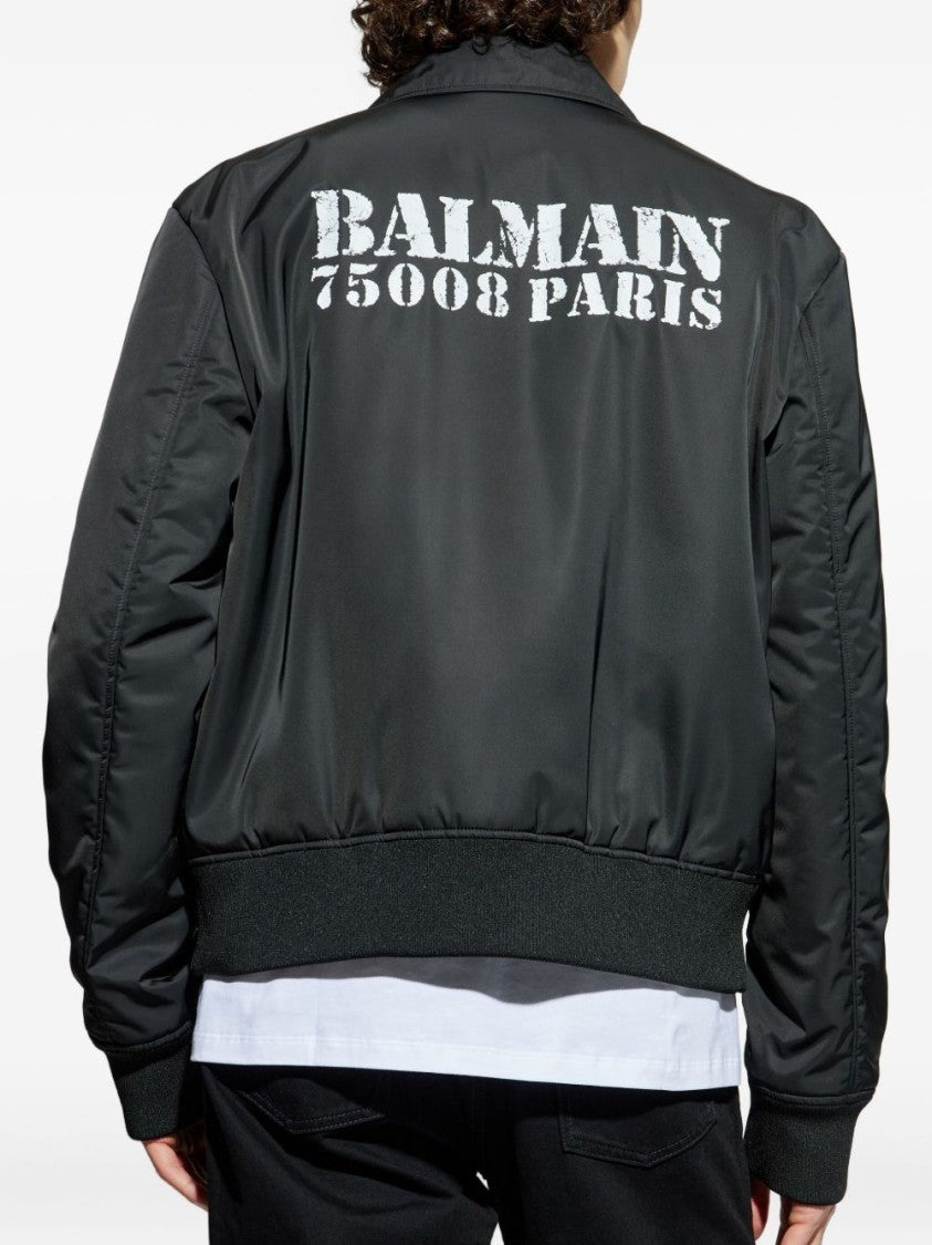 Balmain Contemporary Black Coat With Ribbed Cuffs And Flap Pockets