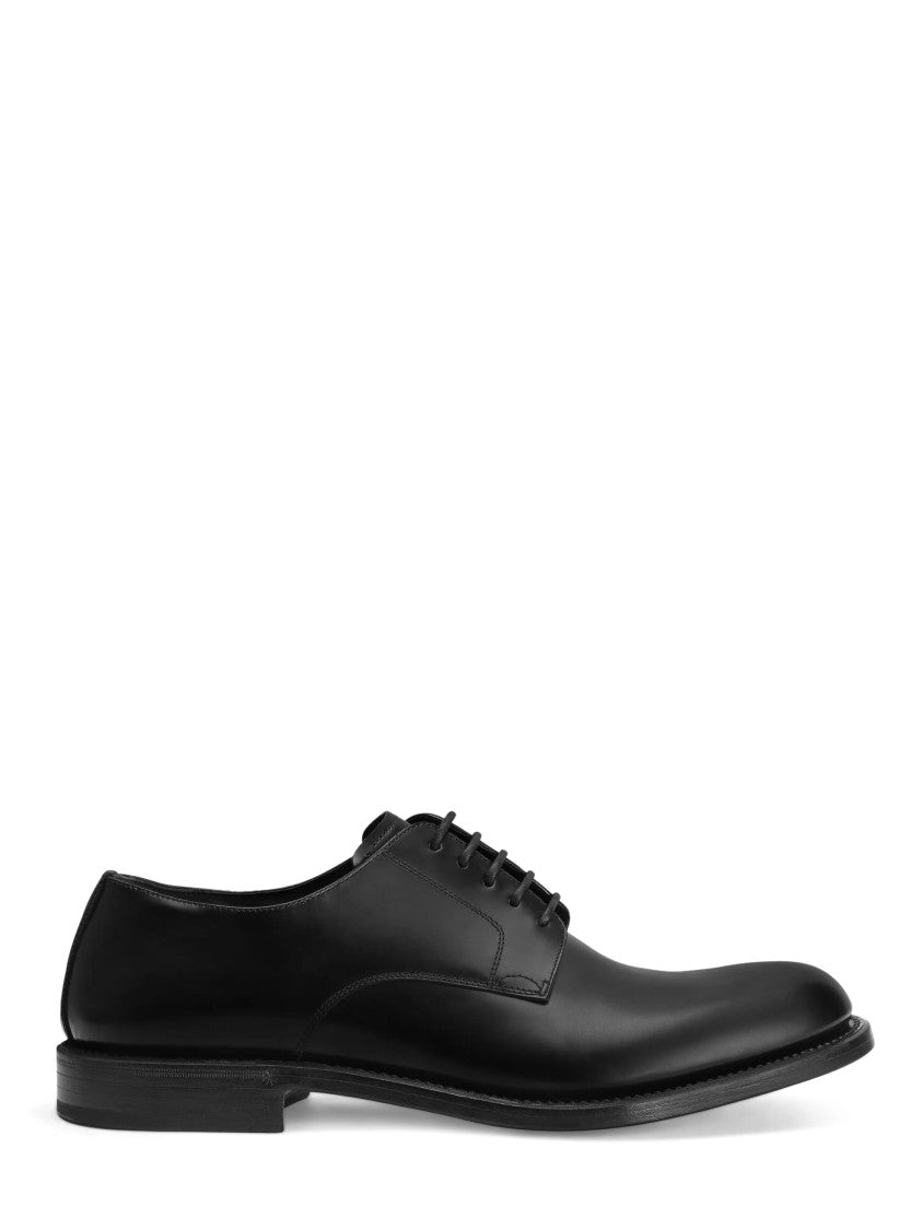 Dolce & Gabbana Streamlined Black Leather Lace-Up Flat Shoes