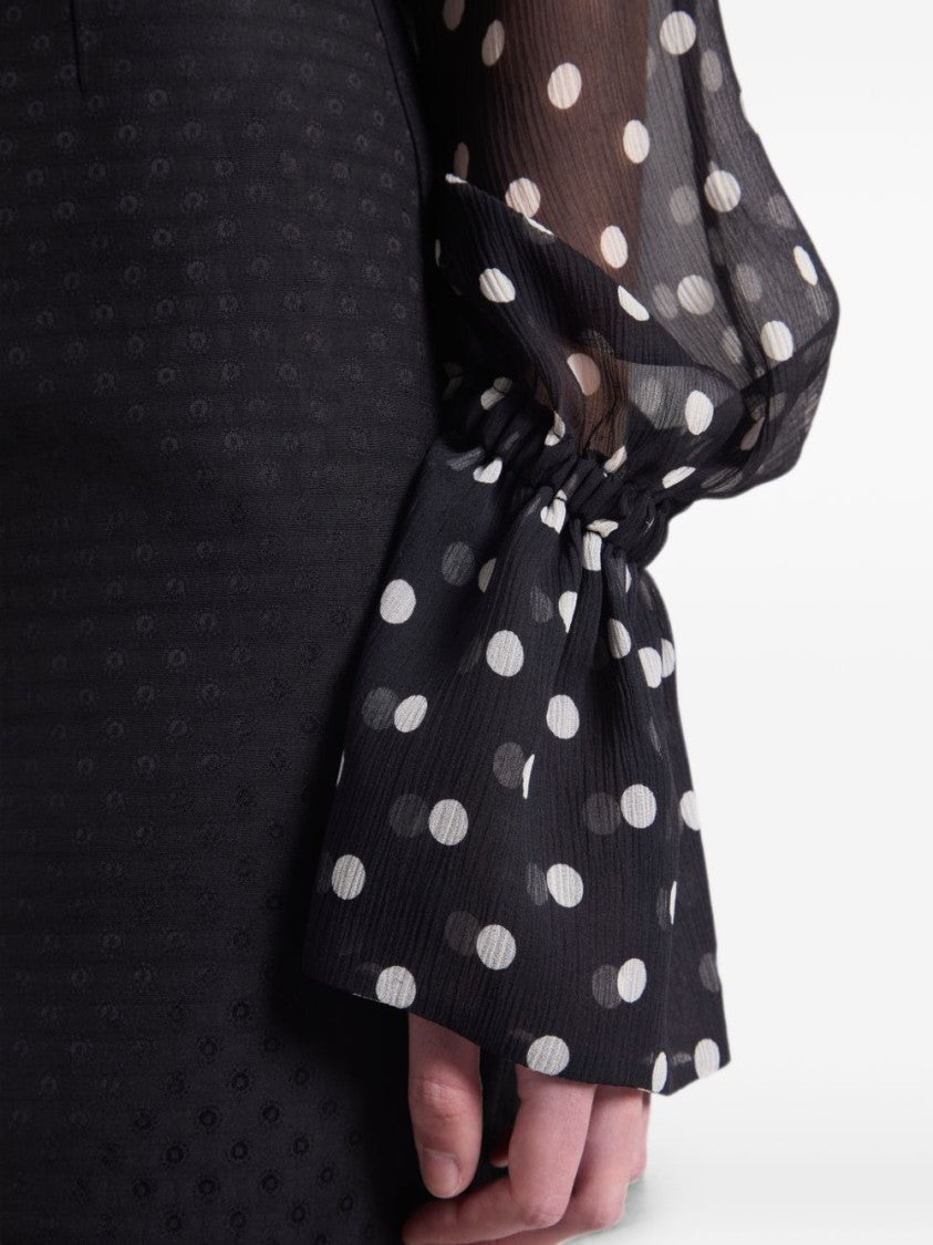 Nina Ricci Sheer Black Blouse With Polka Dot Pattern And Flared Cuffs