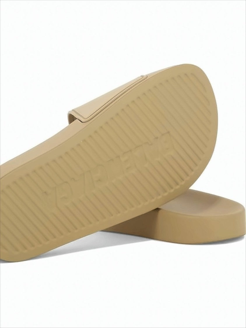 Balenciaga Rubber Slip-On Mules With Textured Sole And Raised Lettering