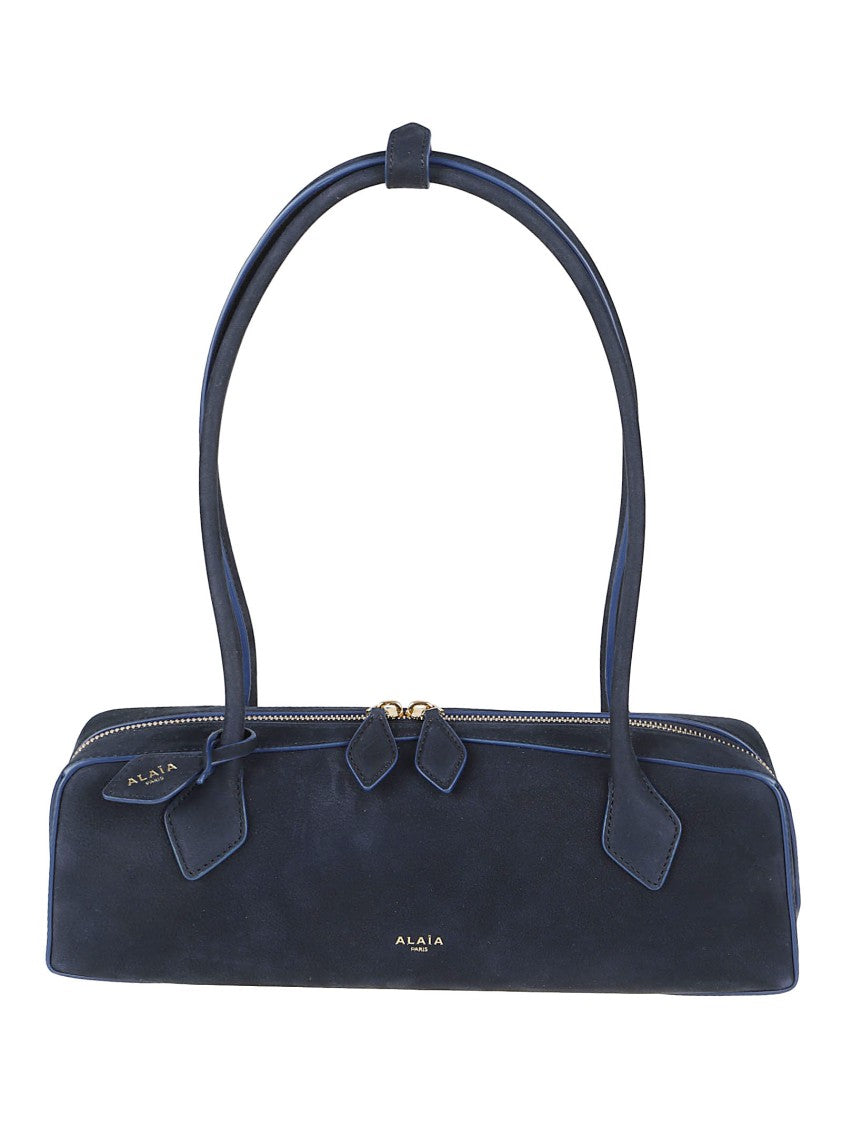 Alaïa Structured Blue Handbag With Minimalist Design And Gold Accents