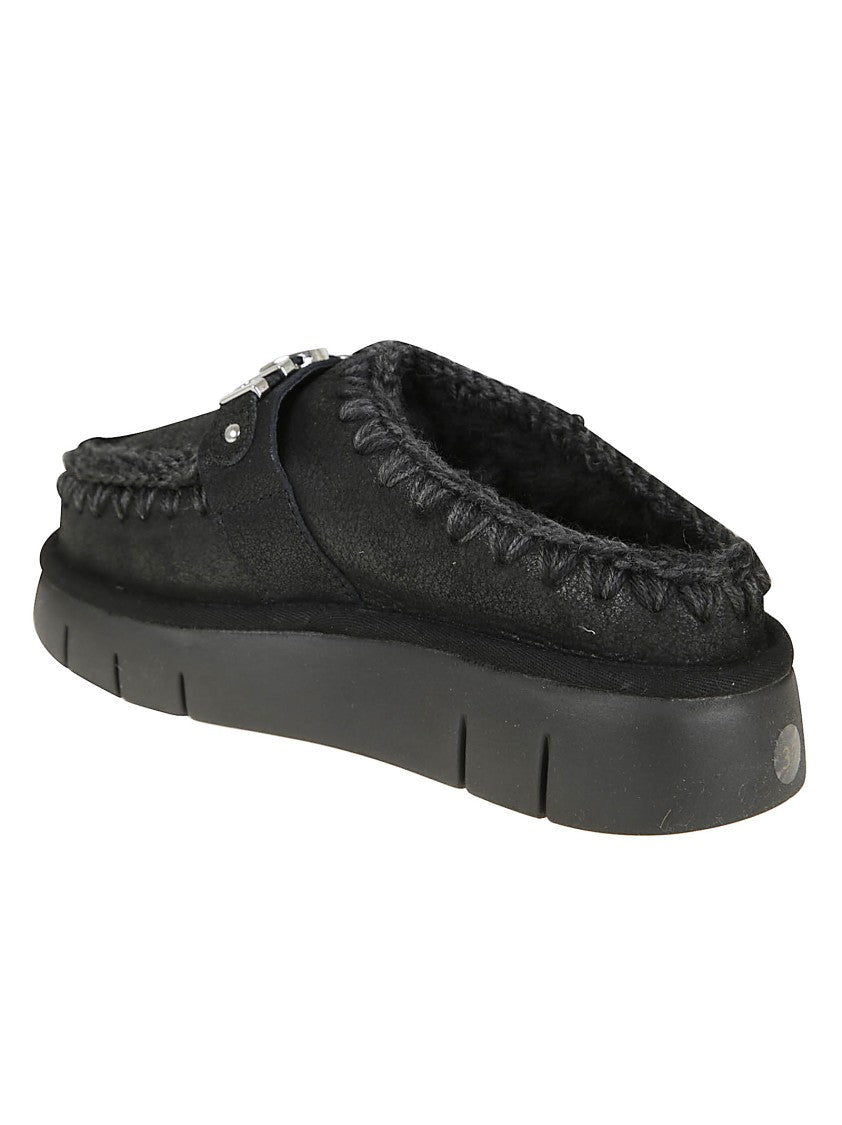 Mou Moccasin-Inspired Black Slip-On Ankle Boots With Whipstitch Detailing