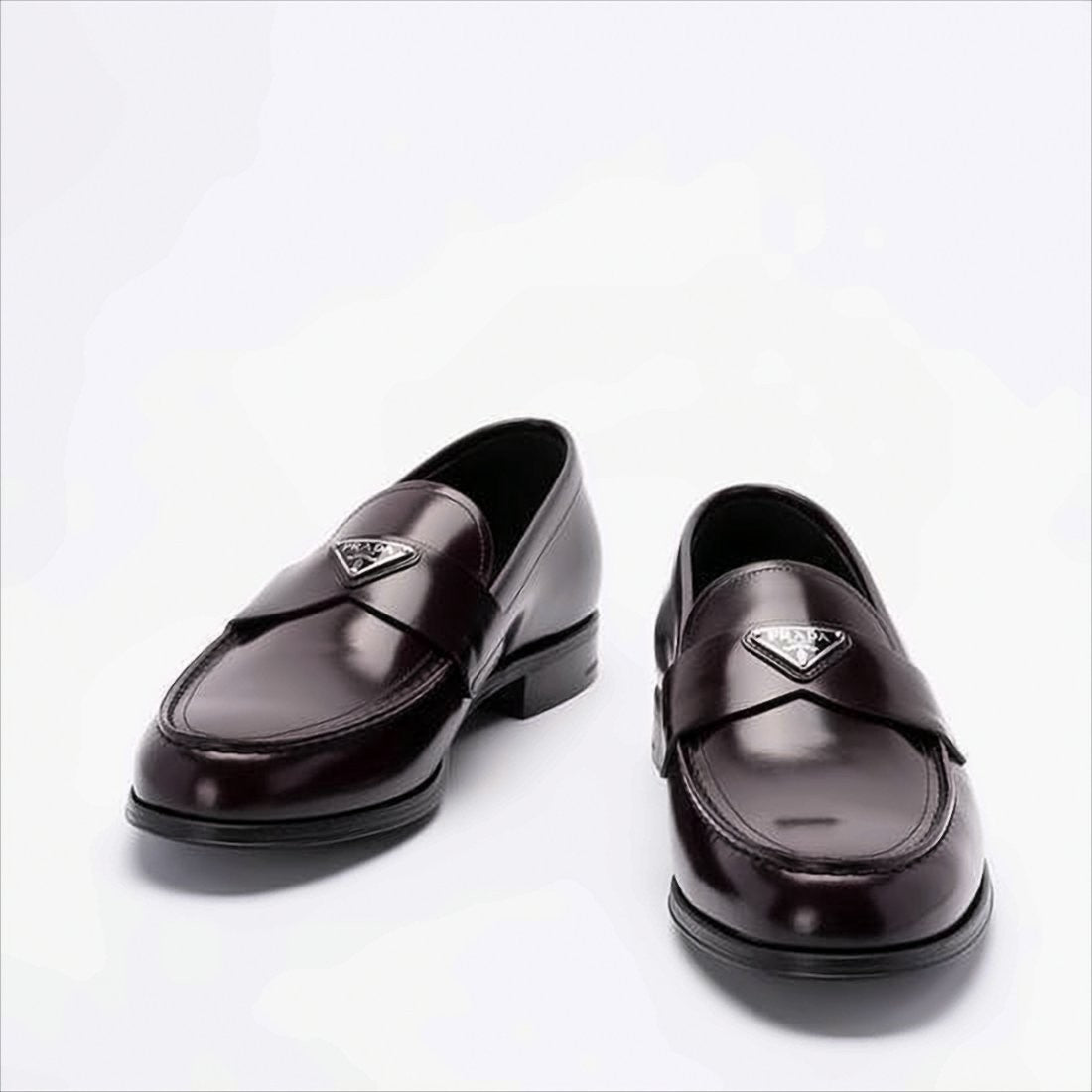 Prada Burgundy Leather Loafers With Metallic Emblem