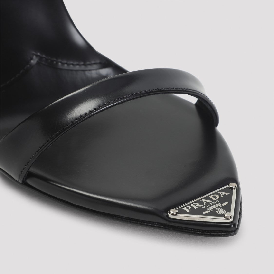 Prada Pointed Toe Sandals With Adjustable Ankle Strap And Metallic Logo