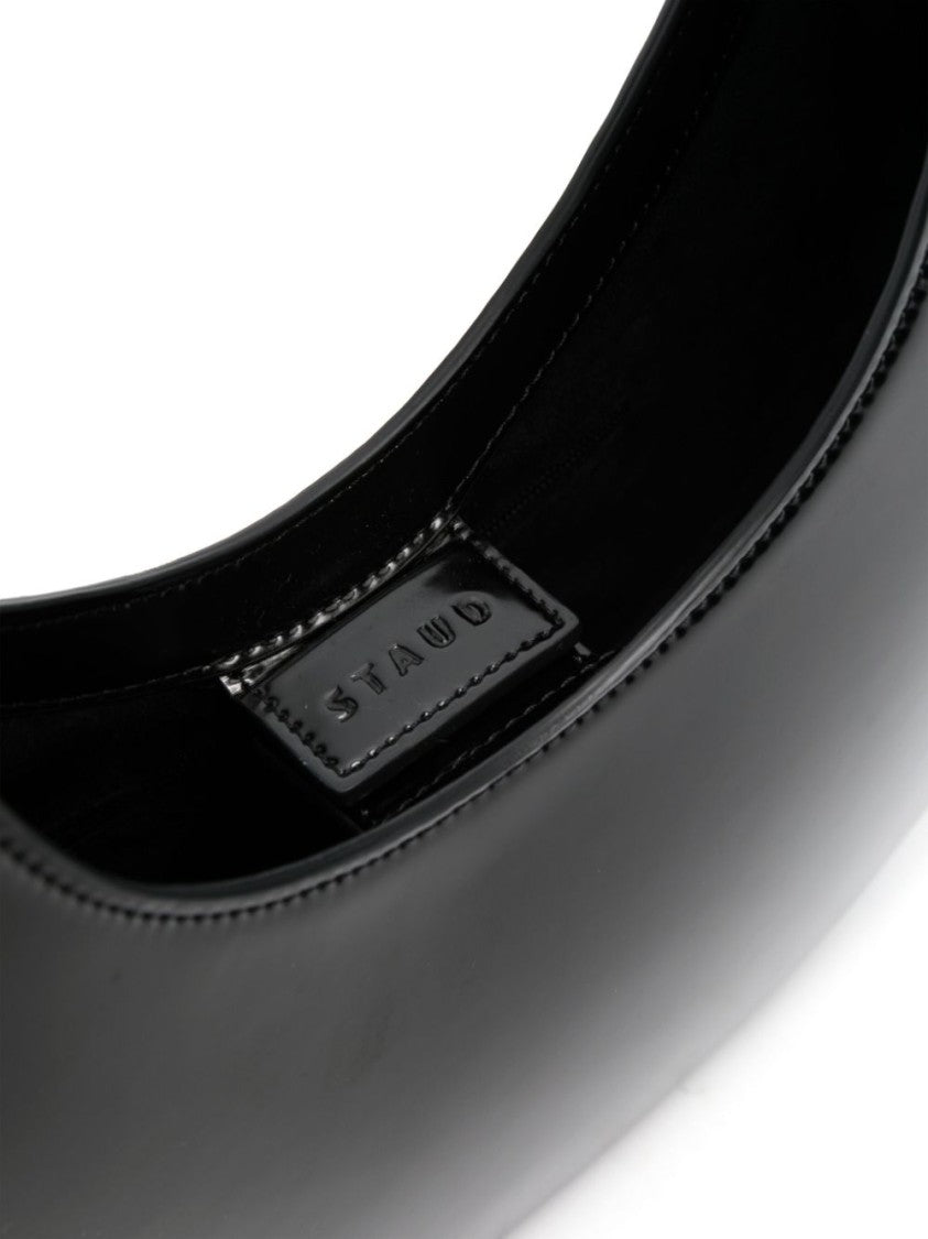 Staud Crescent-Shaped Shoulder Bag In Glossy Black Leather