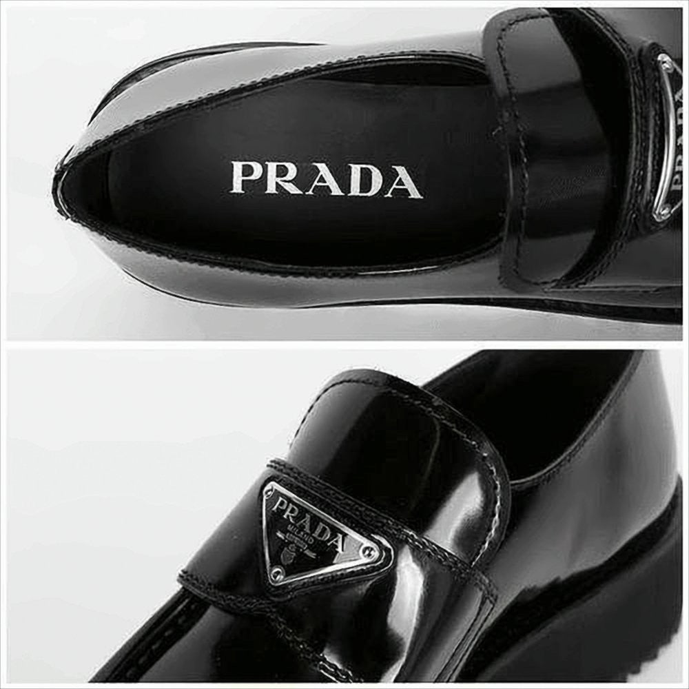 Prada Polished Leather Loafers With Triangular Metal Logo