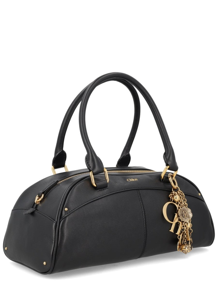 Chloé Sleek Elongated Black Leather Bowling Bag With Gold Hardware