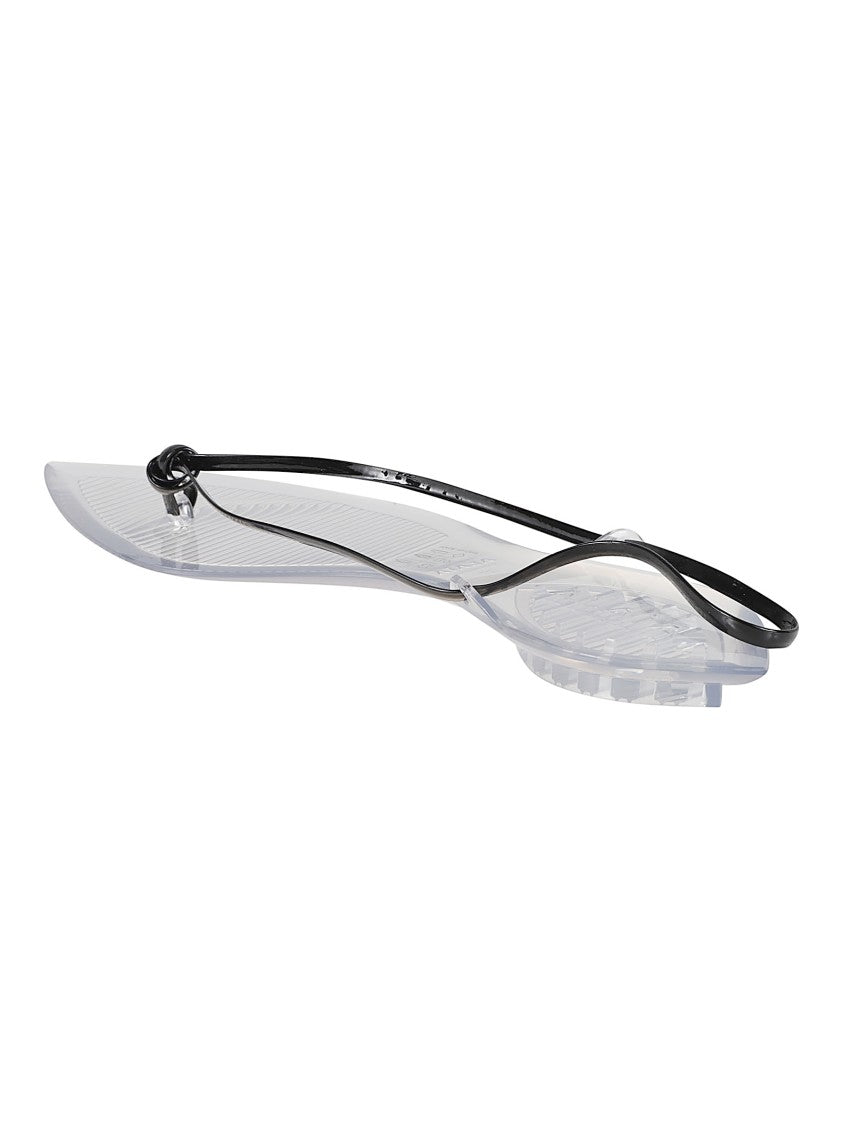 Alaïa Flat Thong Sandals With Glossy Finish And Pointed Details