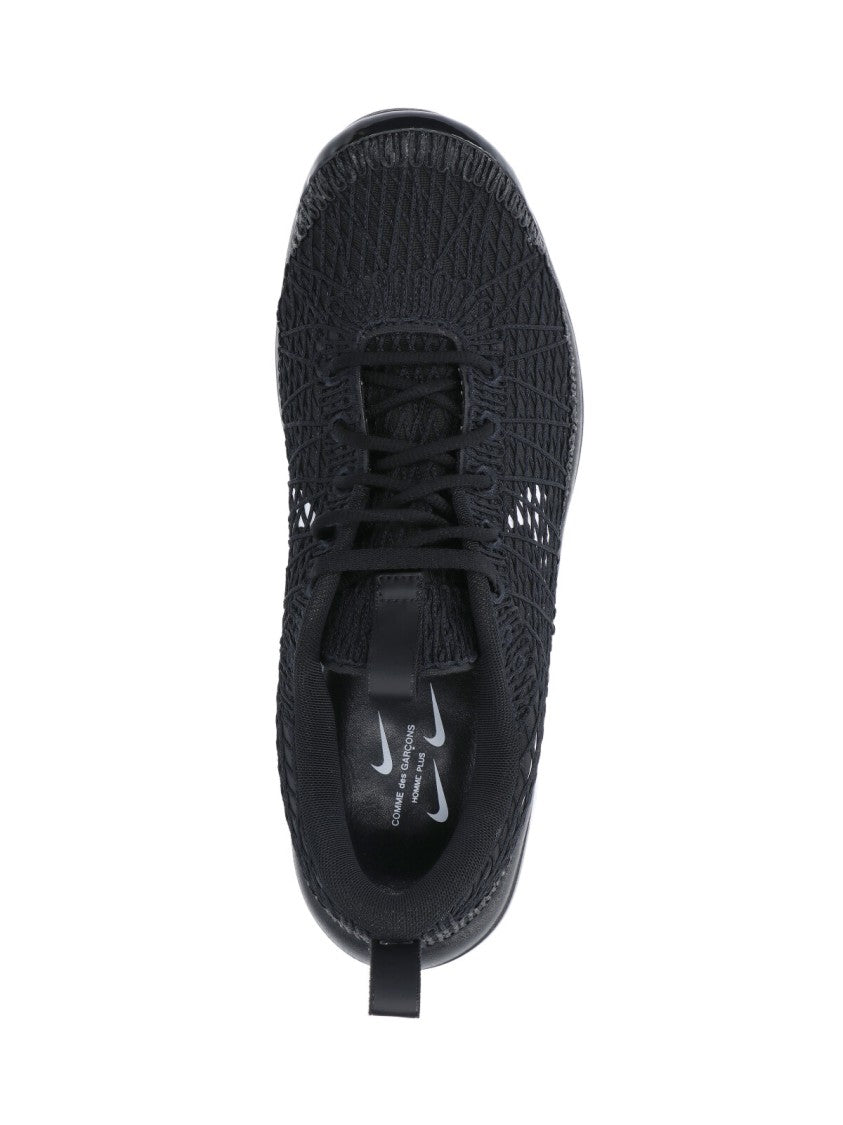 Comme Des Garçons Textured Black Sneakers With Low-Profile Design And Distinctive Branding