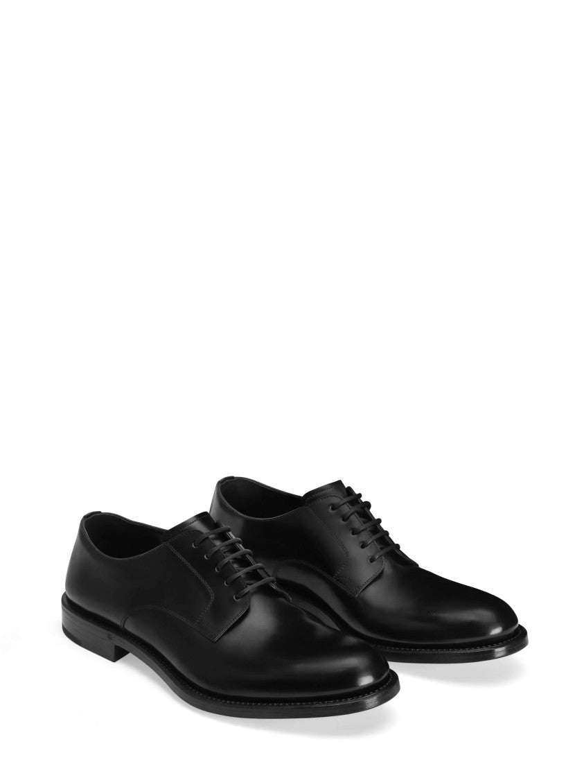 Dolce & Gabbana Streamlined Black Leather Lace-Up Flat Shoes