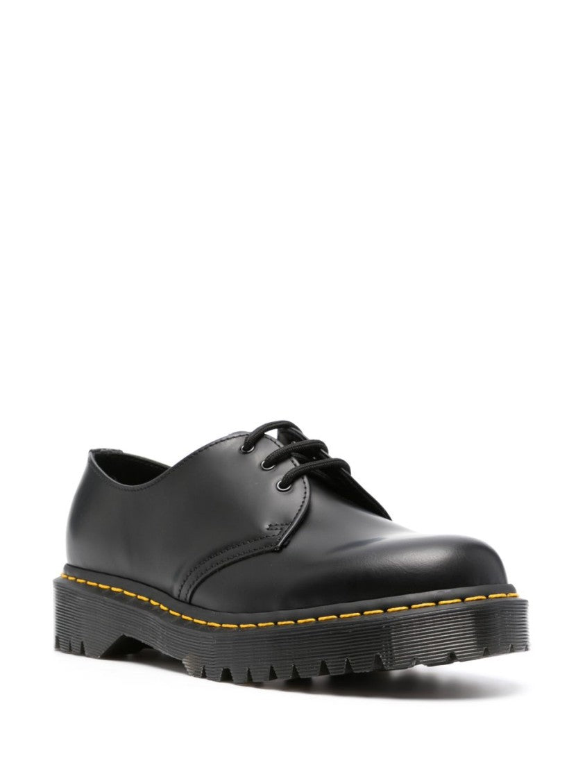 Dr. Martens Polished Black Leather Flats With Chunky Ridged Sole