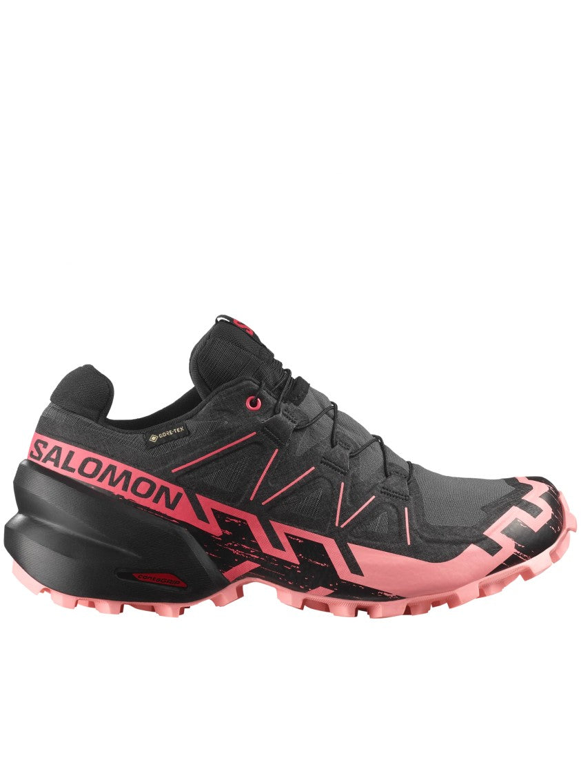 Salomon Streamlined Black Athletic Sneakers With Vibrant Pink Accents