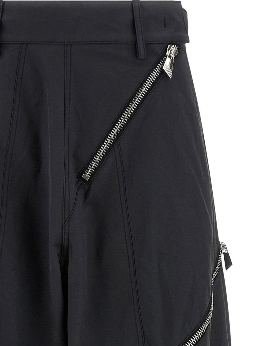 The Attico Cropped Grey Trousers With Diagonal Zipper Accents