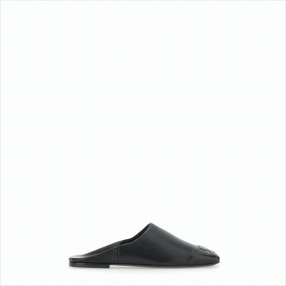 Courrèges Minimalist Black Lambskin Slip-On Mules With Embossed Detail